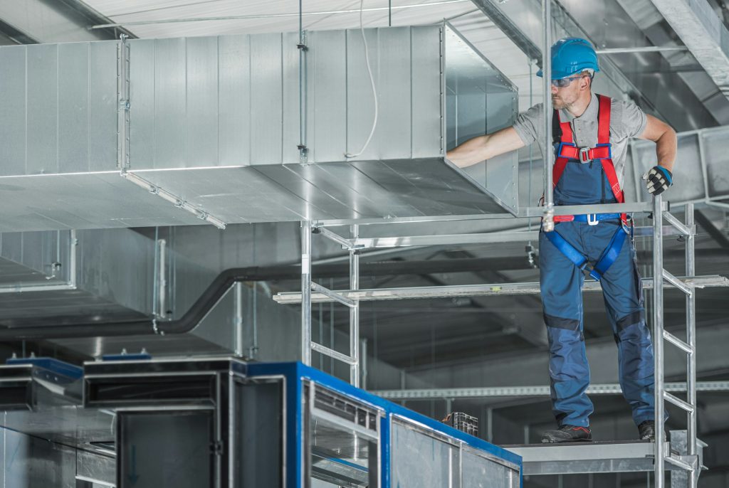 Installing HVAC System Air Circulation Duct Inside a Warehouse